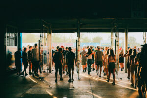 Crowd of people entering music festival. Shot on film